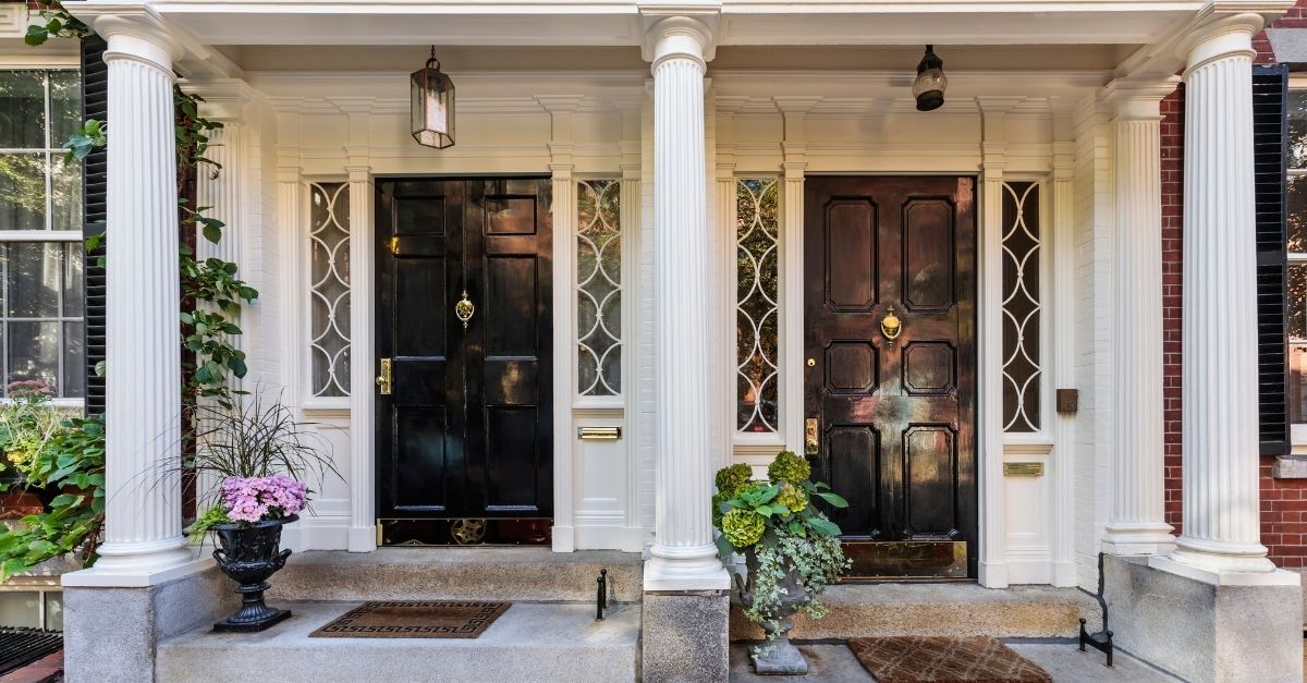 Exterior of Duplex building with two black doors as separate entrances
