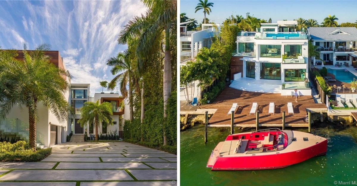 Modern white house with lots of gass on Miami waterfont with dock and red flashy speed boat