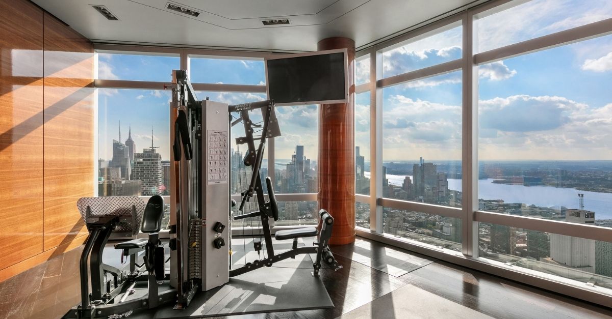 Gym with glass walls overlooking NYC