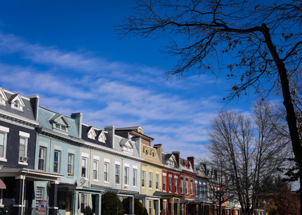 Colorful townhouses against a blue sky