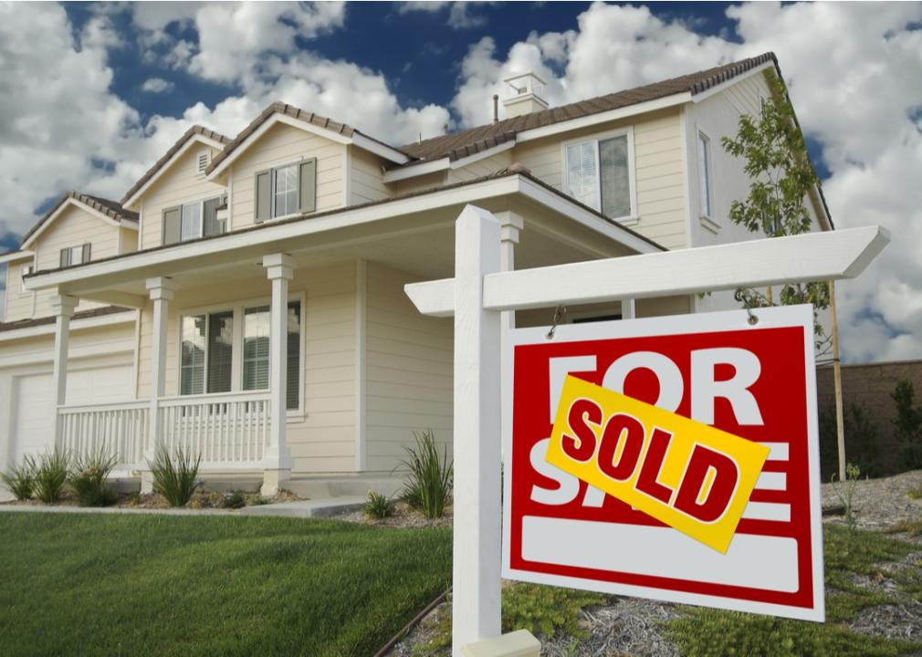 For sale sign on lawn