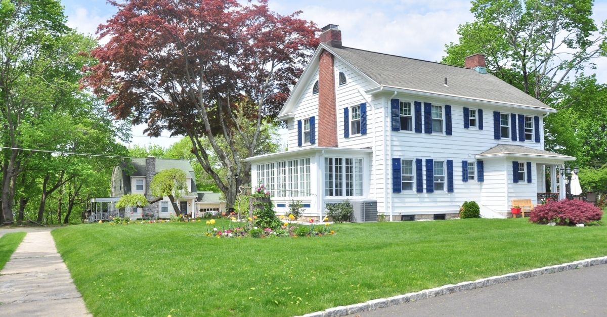 White Colonial style house with chimney