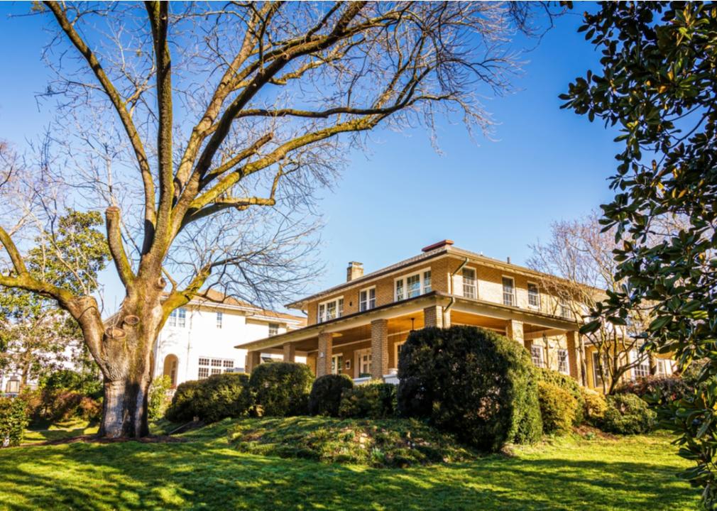 Beautiful 2 story homes with big trees and green lawns.