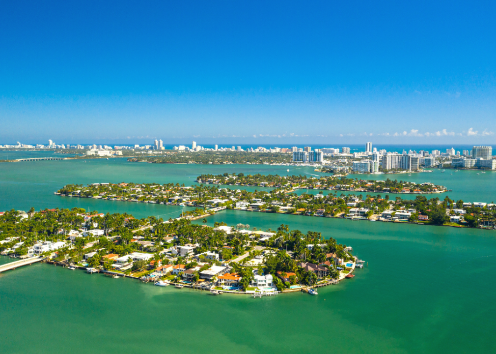 Colorful homes on blue waterfront property.