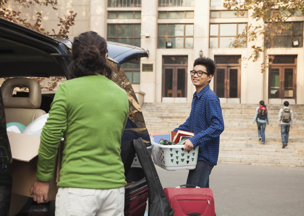 Young man moving into dormitory