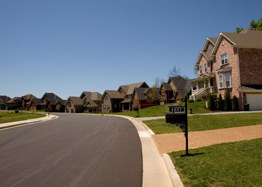 Neighborhood street of brick homes in Nashville, Tennessee.