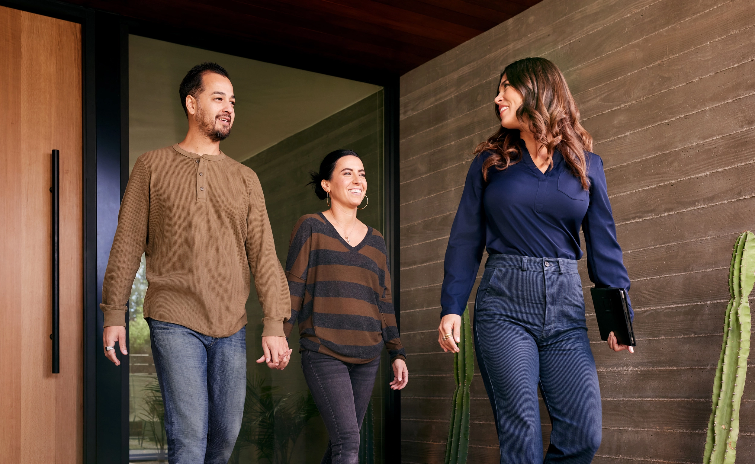 People walking outside a home